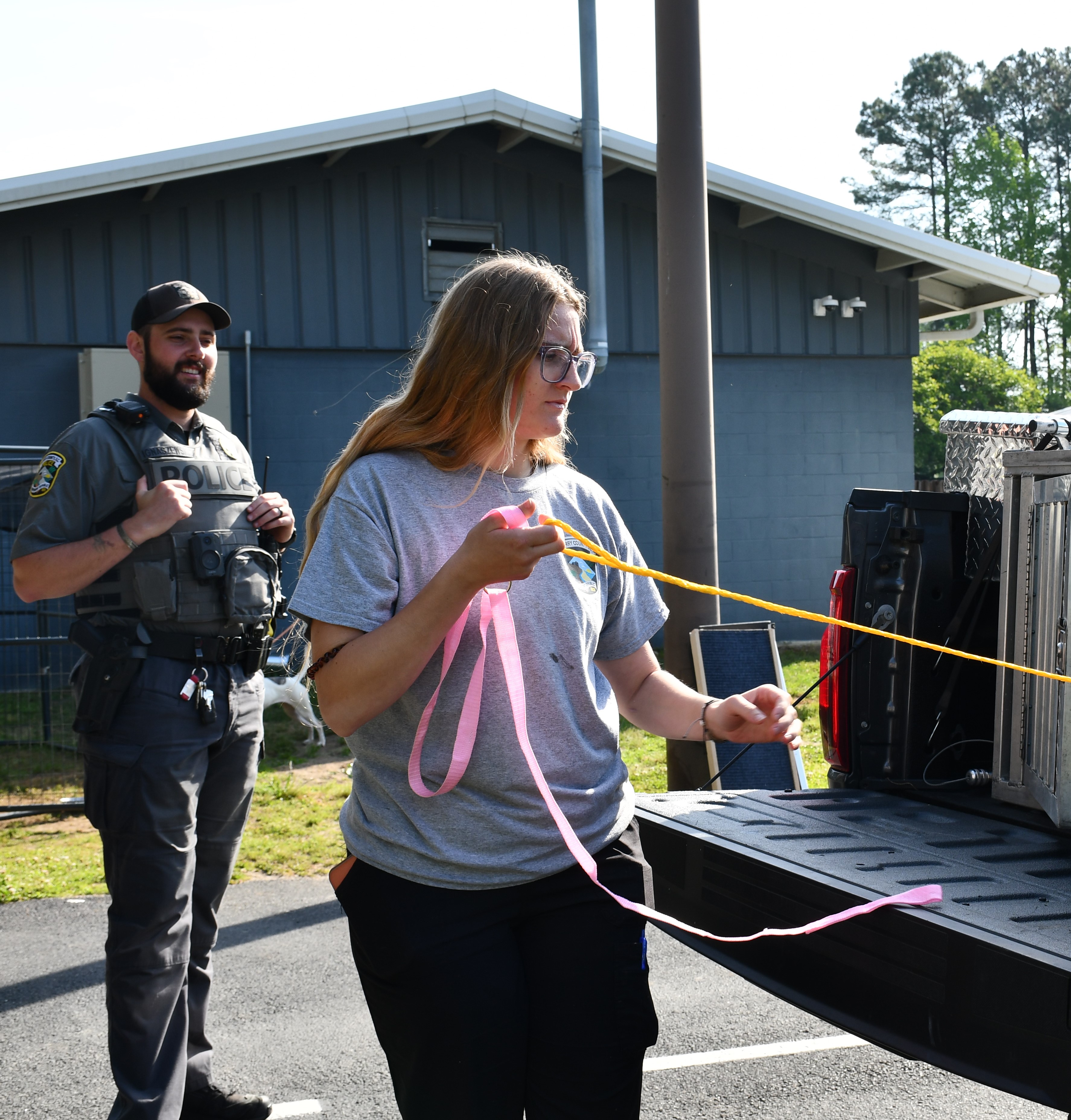 Officer James Ignaszewski and Kennel Attendant Bri Richardson work to on a dog intake at the HCACC.