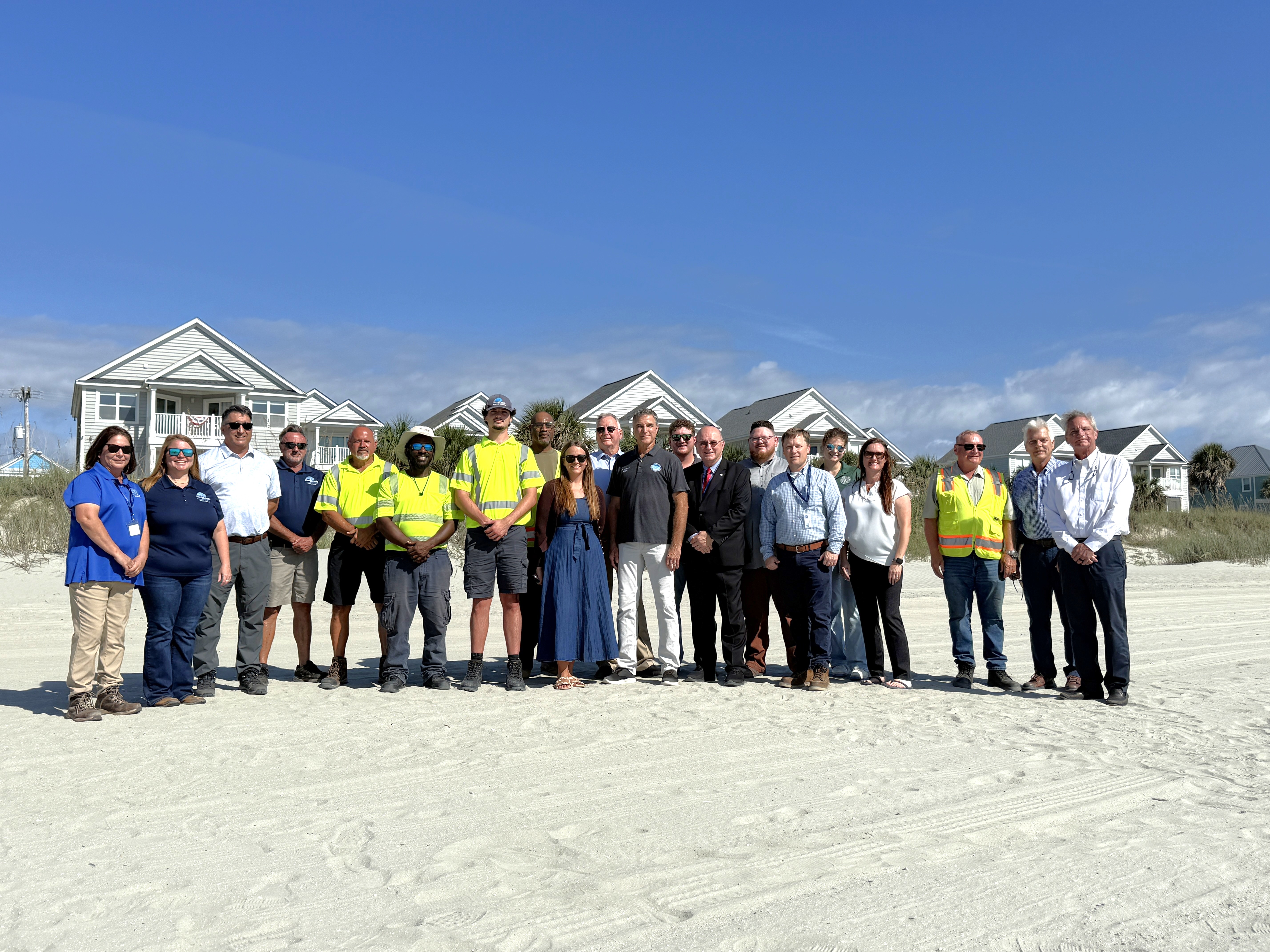 Representatives from various Grand Strand municipalities gather to mark the completion of the Grand Strand Renourishment Project in Garden City