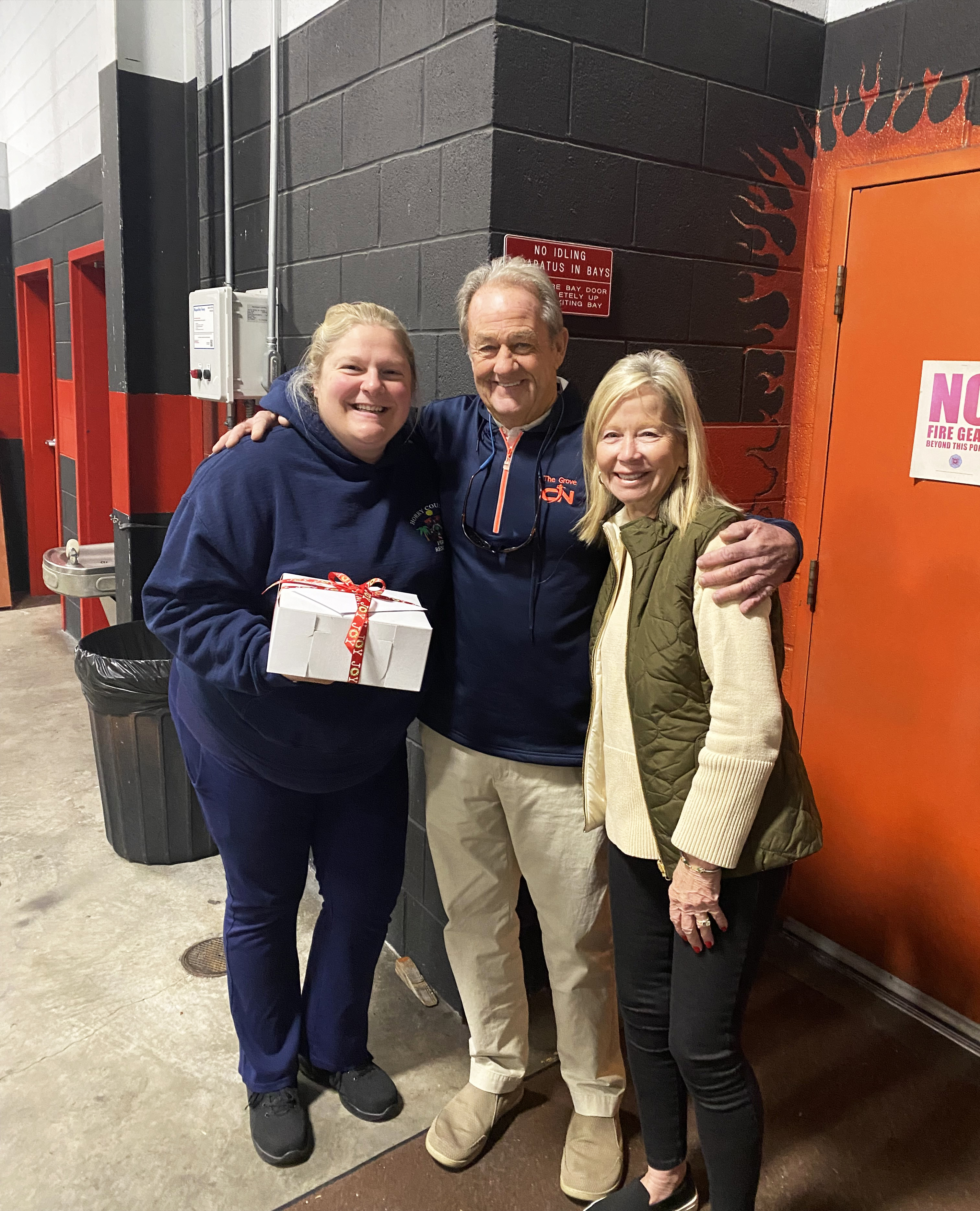 HCFR Firefighter/Paramedic Forbes with the gentleman she helped to save, Andy Apples, and his wife Patty.