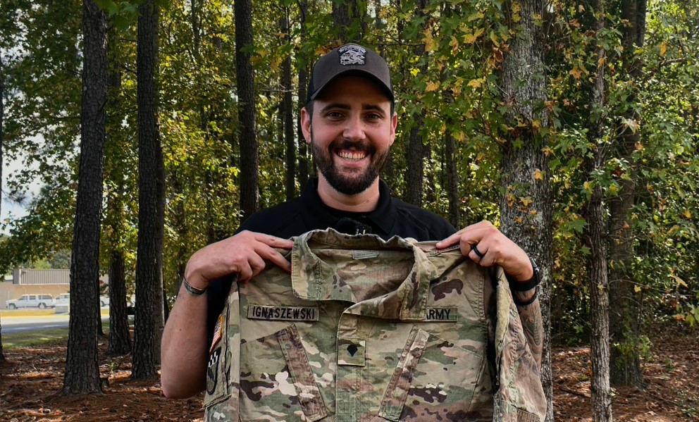 Officer James Ignaszewski holds up his United States Army uniform blouse.
