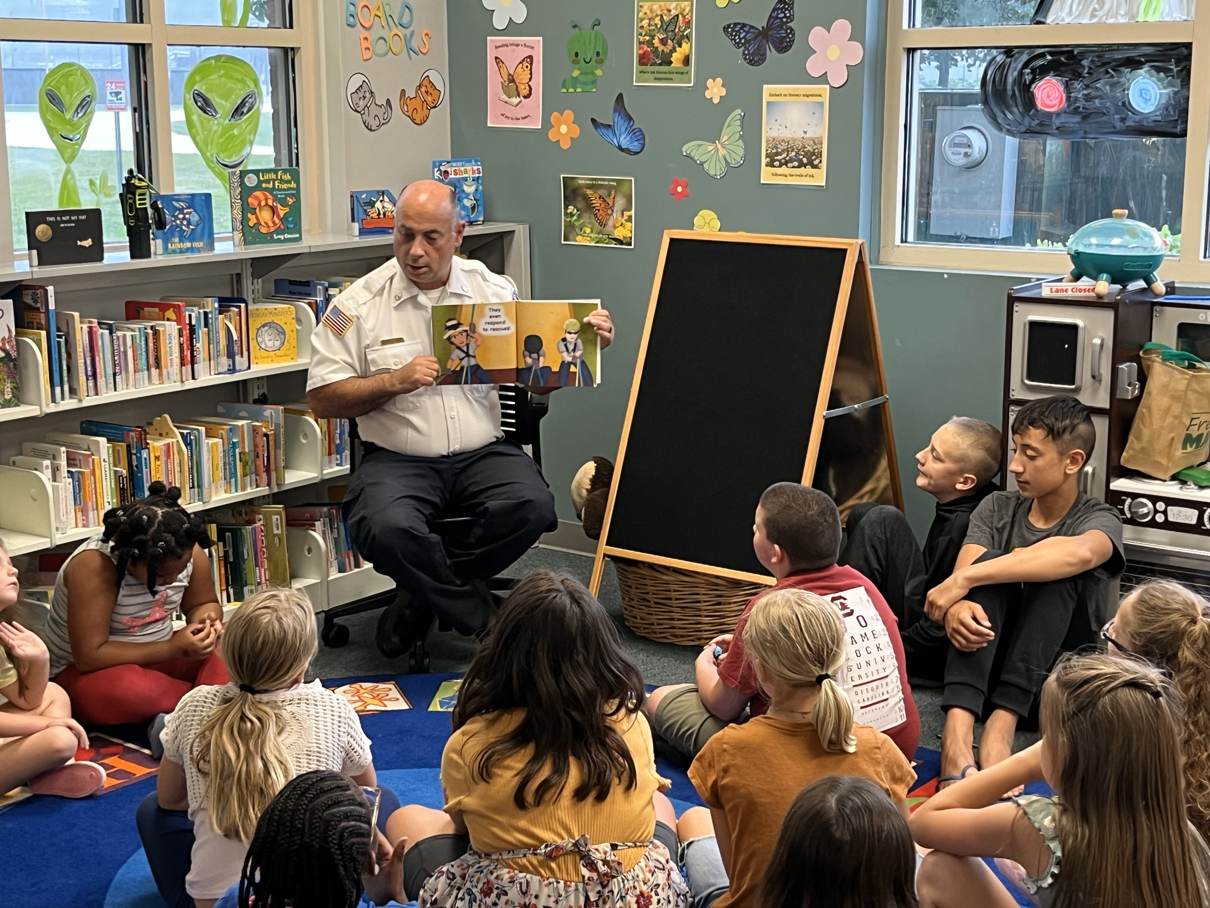HCFR BC Nash, reading to children.